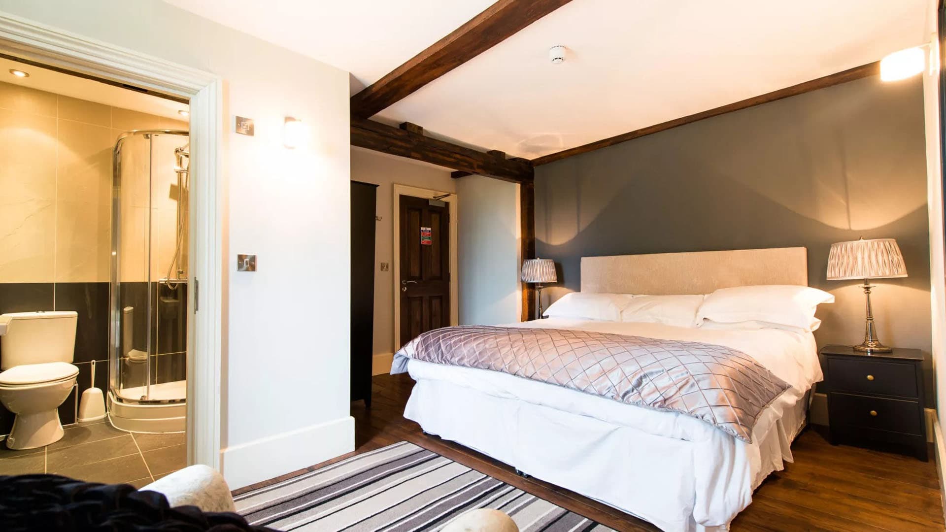 Contemporary room with slate grey walls and walk-in shower